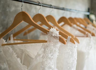 white wedding dress hanging in a house